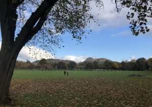 A photograph of the Crags and Arthur's Seat from the Meadows
