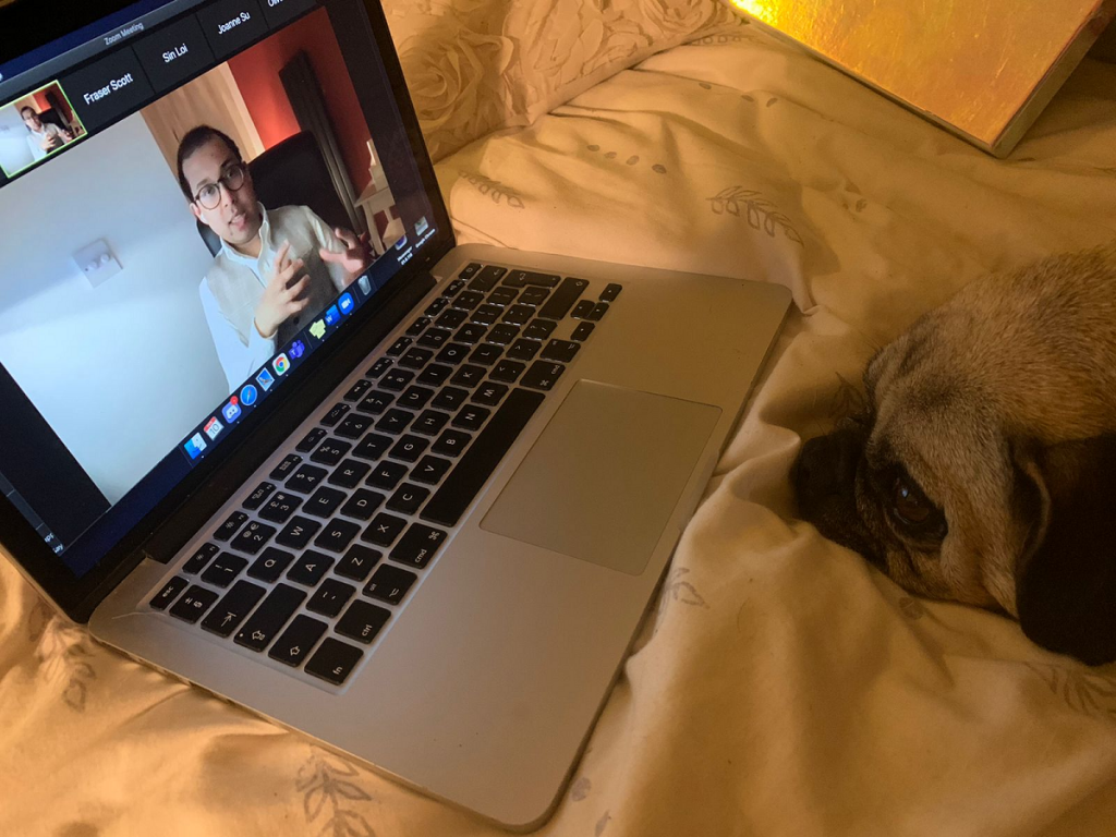 Photograph of a laptop showing Azfarul presenting to the FinTech Society on Zoom.